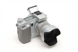 Minolta Dimage 5 (2002) - digitale 3 MP Brigde, 35-250mm, mit SLR-Feeling, wegen extrem langsamen Autofokus Wechsel auf die 7i